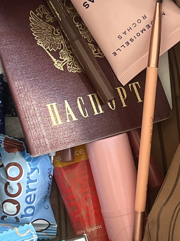 Moscow bedroom details: posters, cosmetics, and personal keepsakes