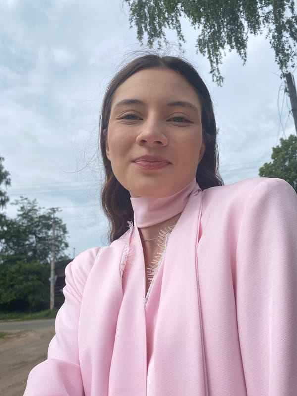 Woman takes outdoor selfies in pink blazer in Votkinsk, Russia