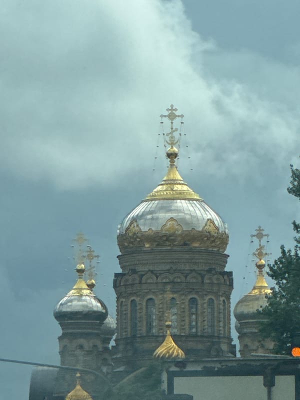 Orthodox domes and city streets on a grey St. Petersburg afternoon