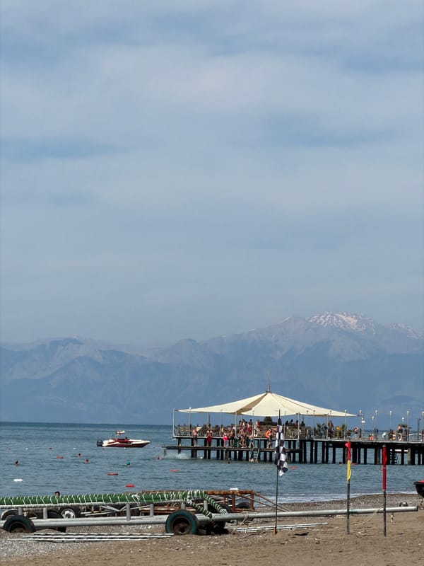 Crowded pier draws visitors in Serik, Turkey coastal scene