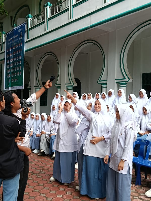 Female students gather for outdoor assembly in Lhokseumawe