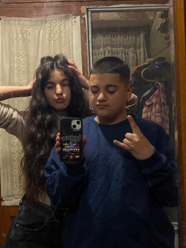 Young couple takes playful mirror selfies in Bulgarian town