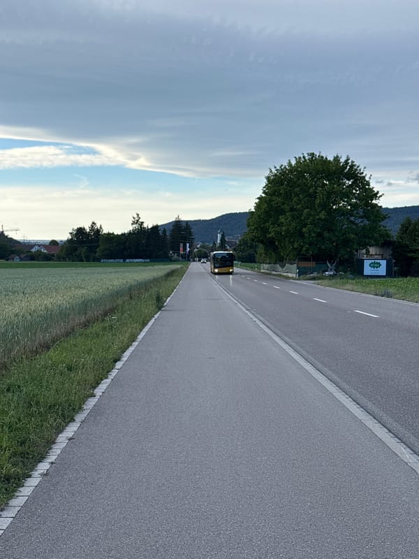 Rural Swiss countryside scenes with bus and parked car