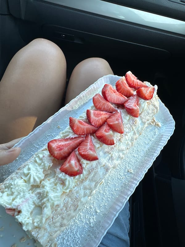 Cake and building photographed moments apart in Kutenholz