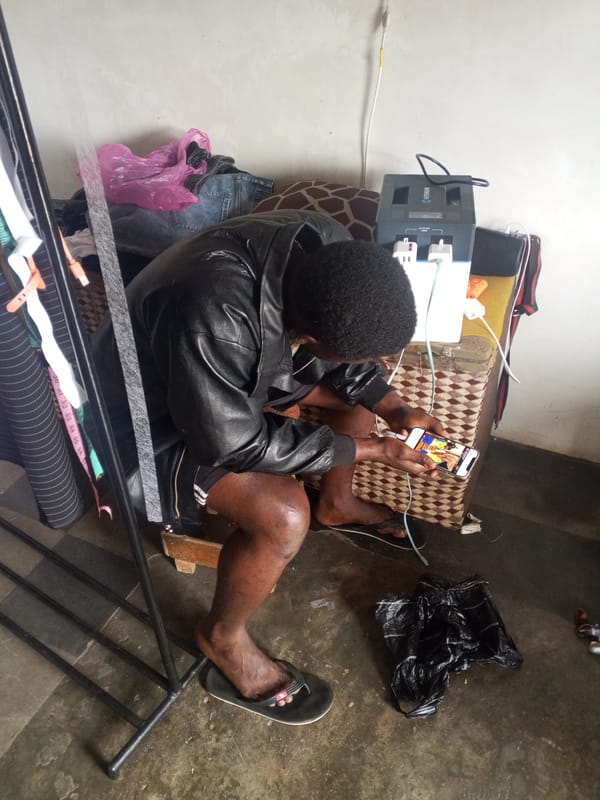 Person observed in indoor space with clothing rack nearby