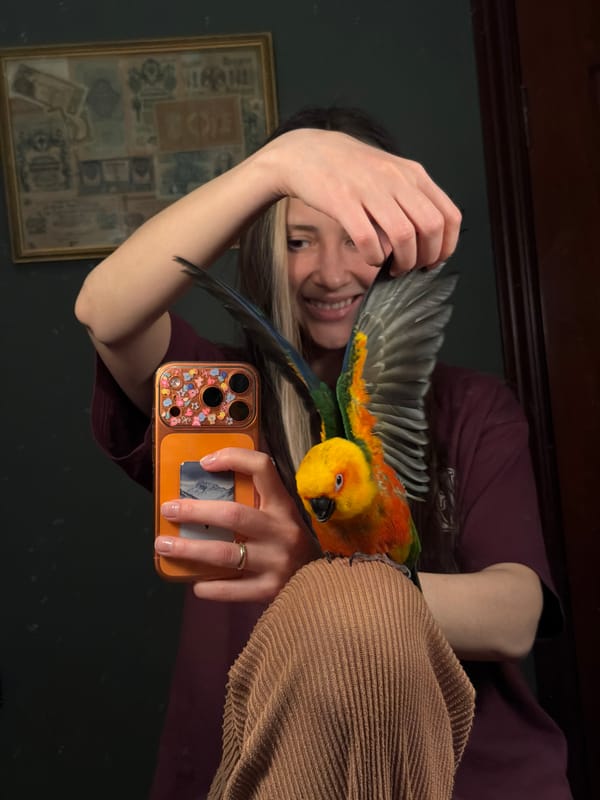 Woman takes selfie with colorful parrot in cheerful moment