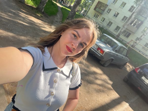 Woman photographs herself among birch trees in Izhevsk morning session