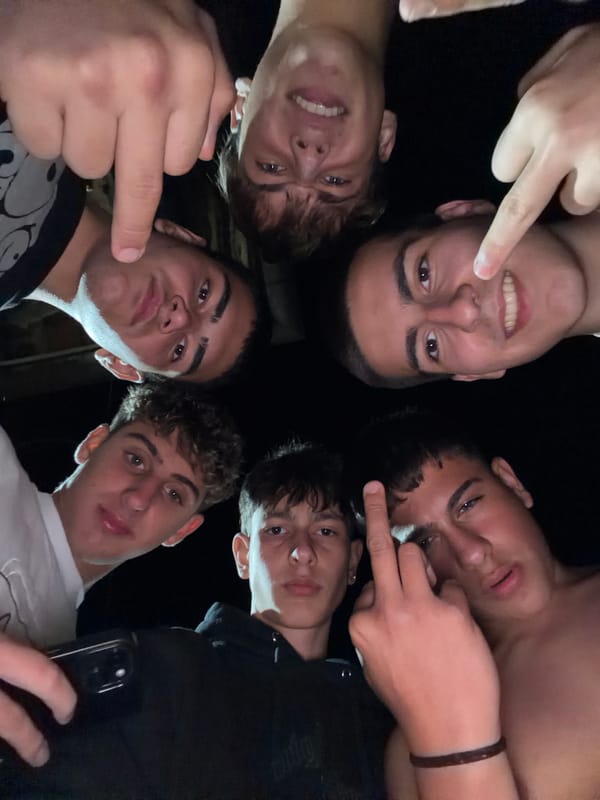 Young men gather for evening social activities in Novi Iskar