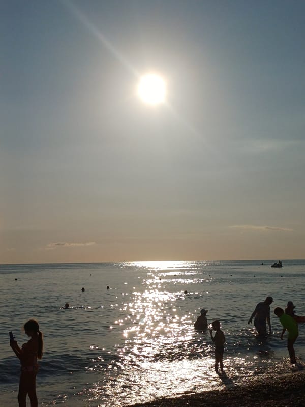 Afternoon at a Sochi Black Sea beach, paddleboarding and swimming