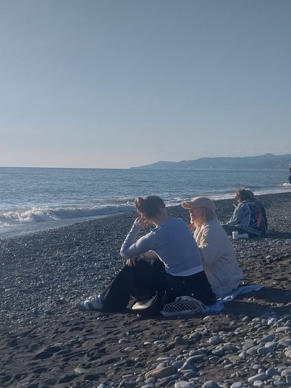 Beachgoers enjoy sunny afternoon activities along Sochi coastline