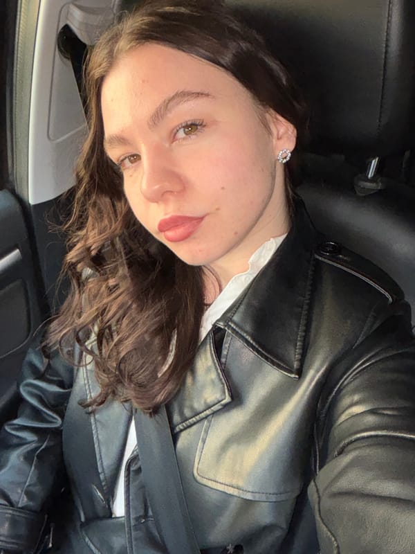 Woman in black leather jacket observed in car, Perm