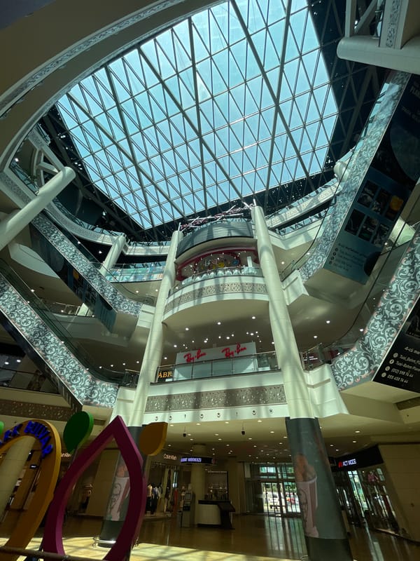 Glass-ceilinged Baku mall with bold abstract art installation