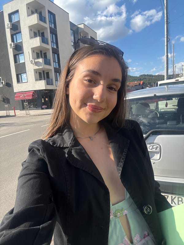 Woman takes sunny day selfie in Pernik, Bulgaria