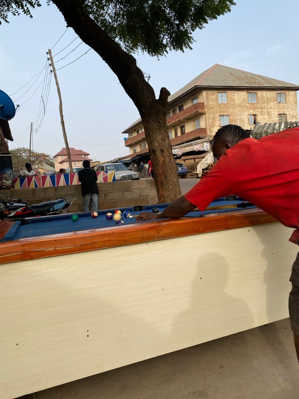 Outdoor billiards game observed in Bukuru, Nigeria