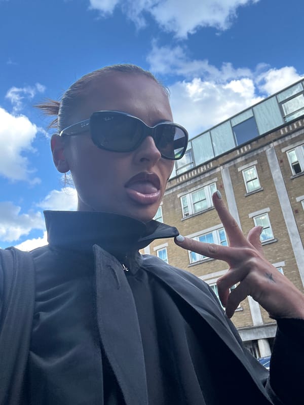 Woman Takes Playful Selfie in London