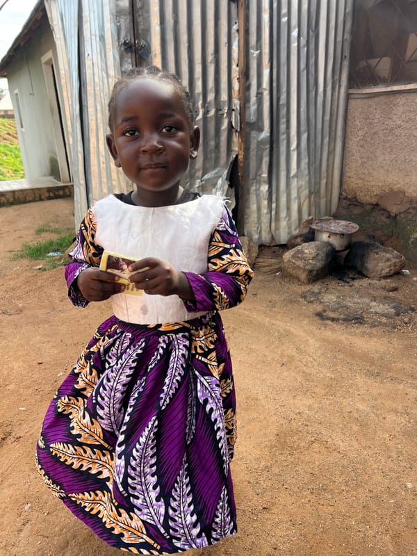 Child in a Jos dirt yard, caught from multiple angles