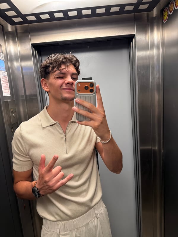 Elevator mirror selfie with a wink in Blagoevgrad