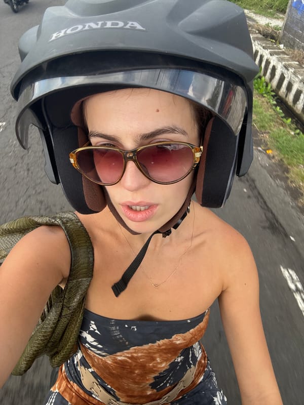 Motorcycle ride through Mengwi with a green snake in tow