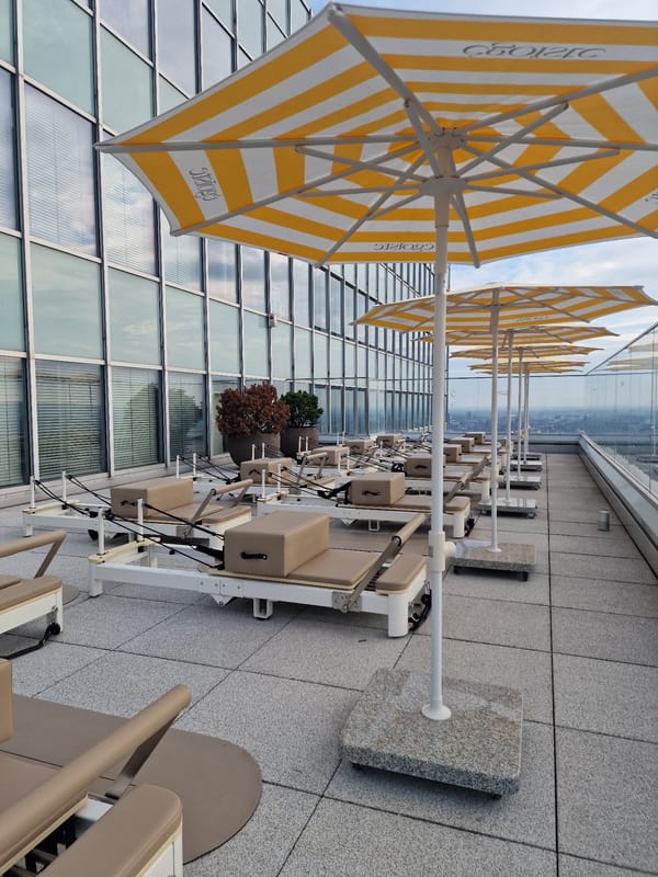 Rooftop Pilates setup and aerial city view, Düsseldorf