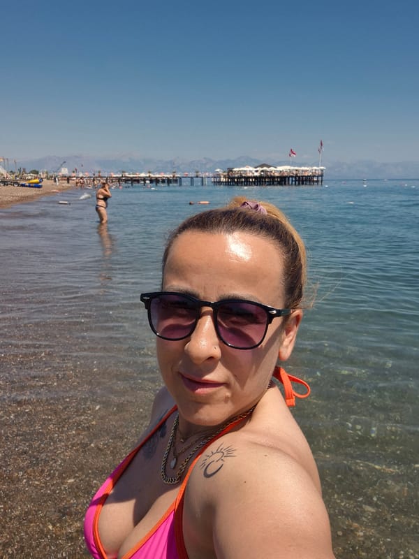 Sunny beach day with selfies, loungers, and shoreline scenes