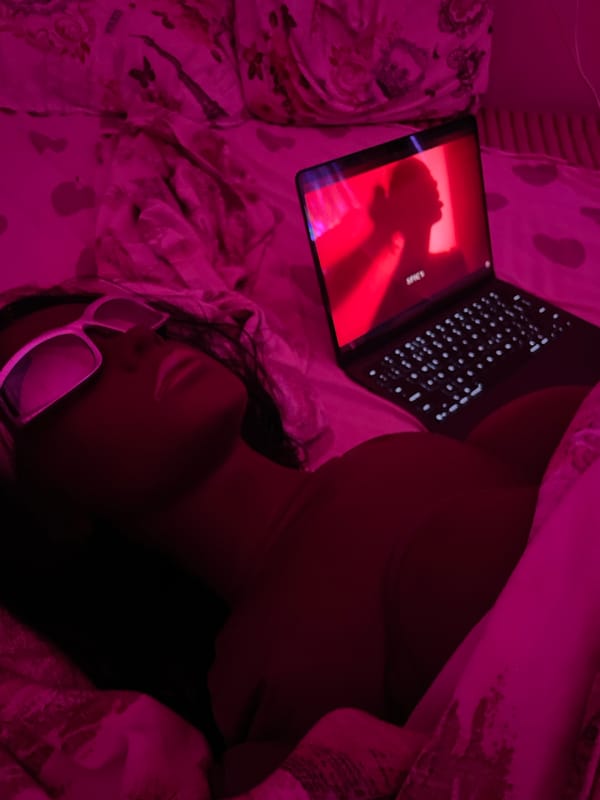 Pink-lit bedroom night with laptop glow and close-up angles