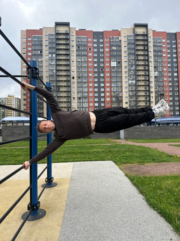 Man performs outdoor calisthenics workout in Murino, Russia