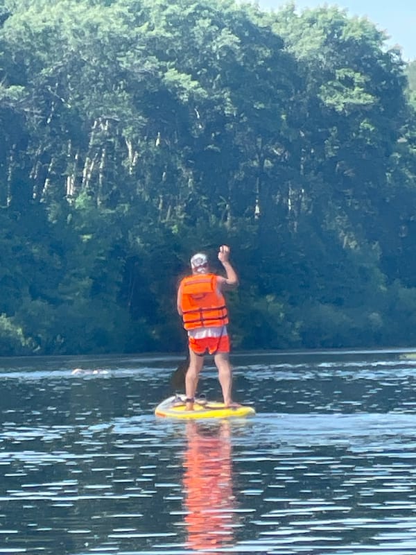 Paddleboarders enjoy sunny morning on Vologda River, Russia
