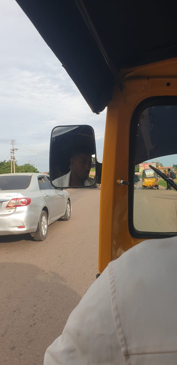 Morning traffic observed from auto-rickshaw in Sabon Tasha, Nigeria