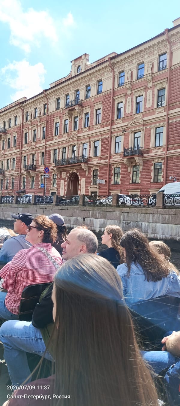 Canal boat tour drifts past Saint Petersburg's landmarks