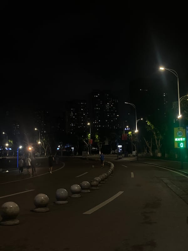 Nighttime scooter ride documented in Jiulongpo District, China