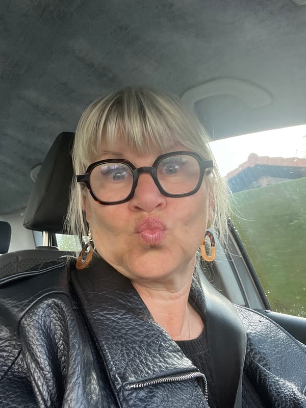 Woman Takes Selfies in Car in French Village