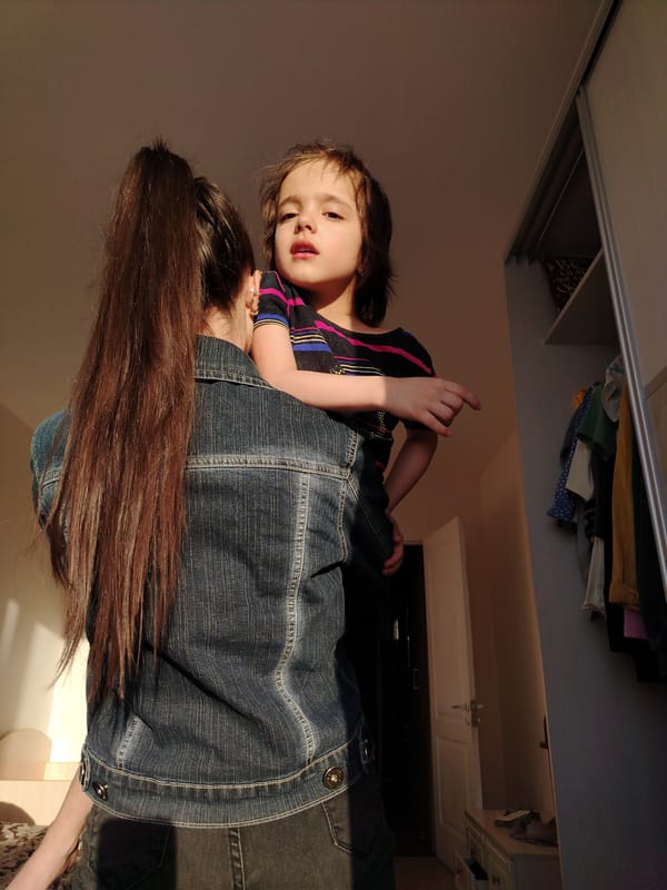 Woman takes kitchen and outdoor selfies with oranges