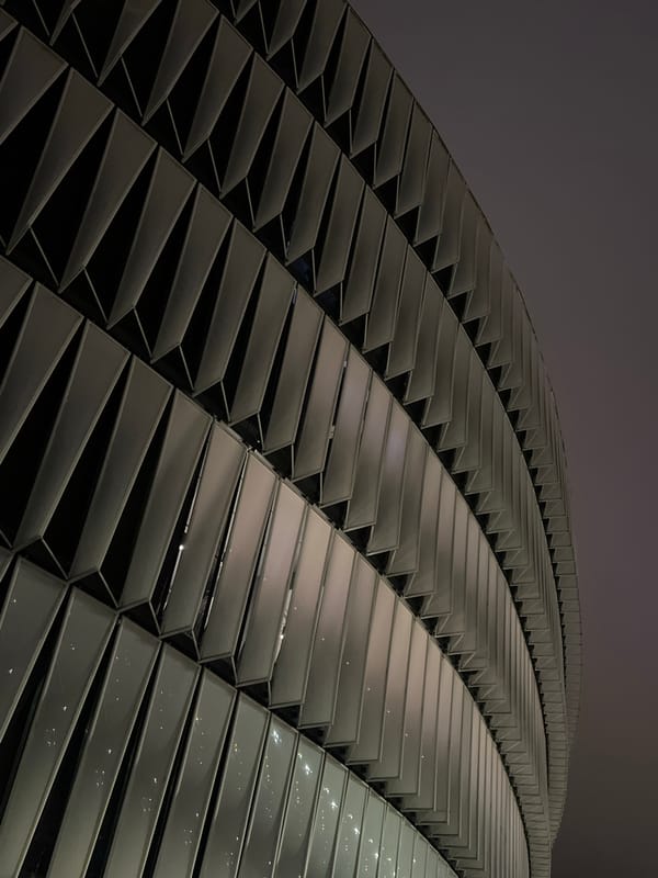 San Mamés Stadium exterior glowing at night in Bilbao