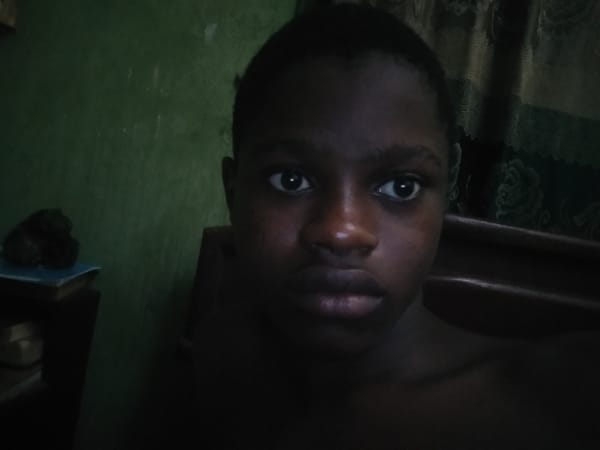 Person documents late-night moments in bedroom selfies in Nigeria
