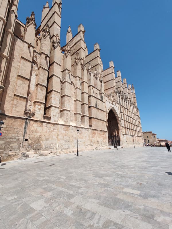 Low-angle views of La Seu's sandstone Gothic facade, Palma
