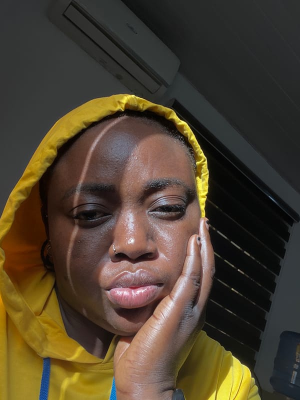 Morning street documentation captures person in yellow hoodie around Abuja