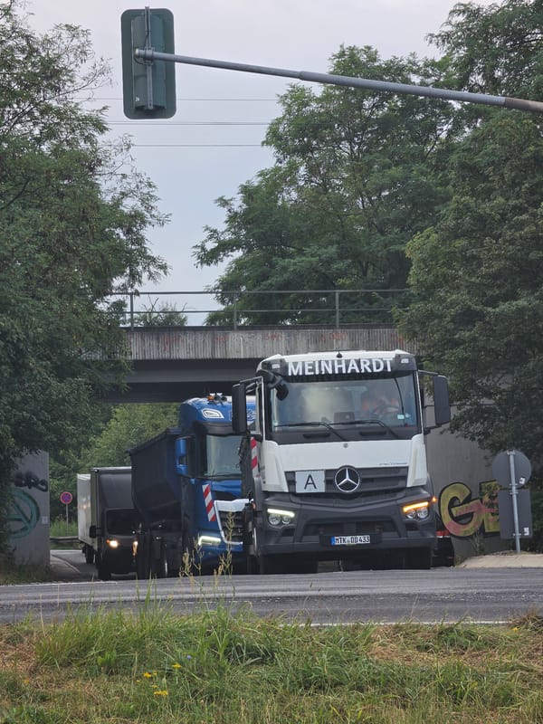 Freight trucks and riverside industry along Kelsterbach's cargo corridor
