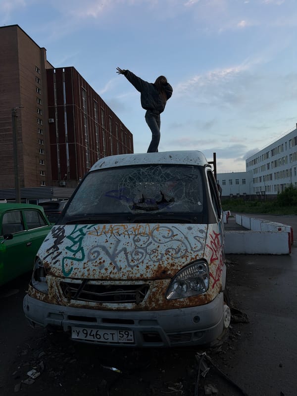 Young people gather around abandoned van in Perm