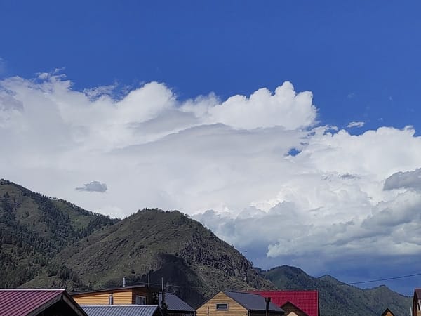 Rooftops and mountain skyline in Chemal, Altai Republic