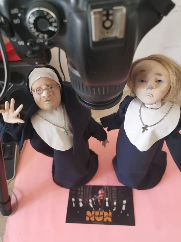 Nun dolls photographed beneath digital camera in Prague