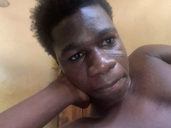 Person documents laptop video call session in Mararaba, Nigeria