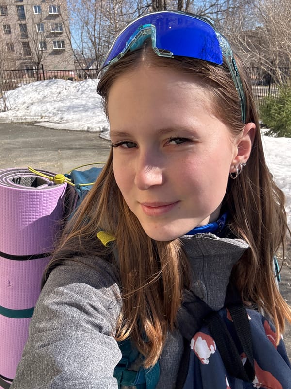 Young person takes selfies with yoga mat in Berezniki