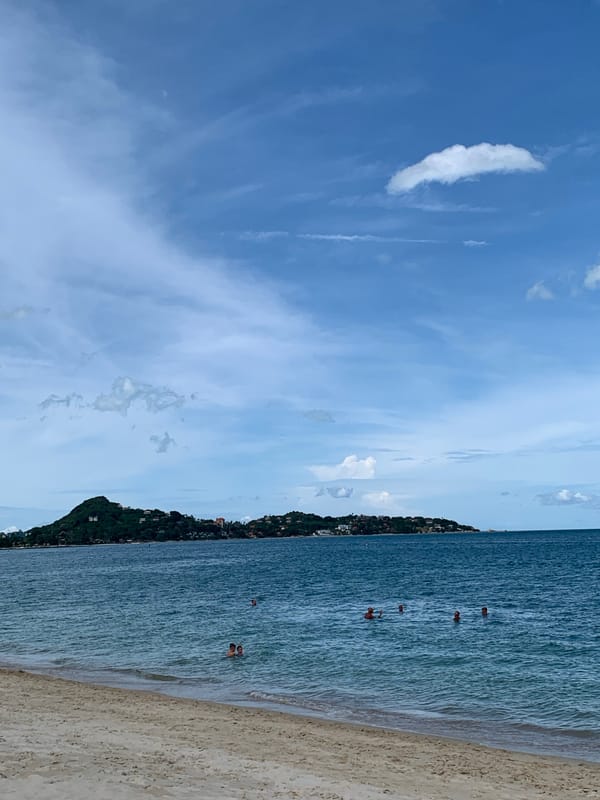 Beach morning on Ko Samui: paddleboarding and inflatable water park