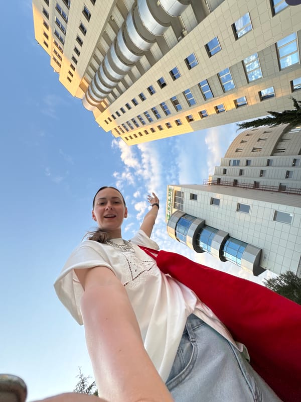 Woman documents casual afternoon exploring Sochi landmarks and recreational spots