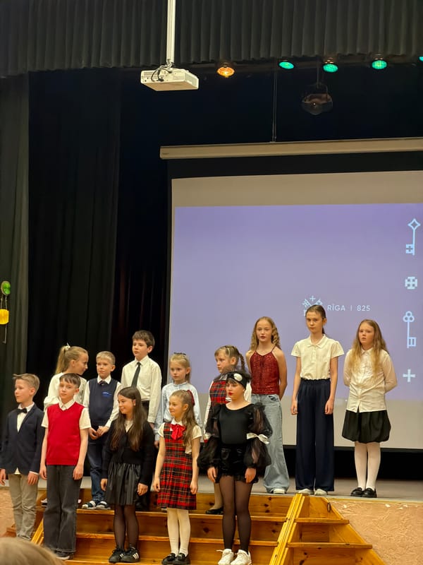 Children perform in matching outfits on Riga stage