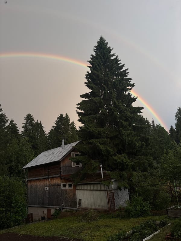 Double rainbow captured over rural Zhebrei, Russia