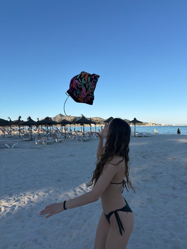 Woman enjoys sunny afternoon at Alcúdia beach in Spain