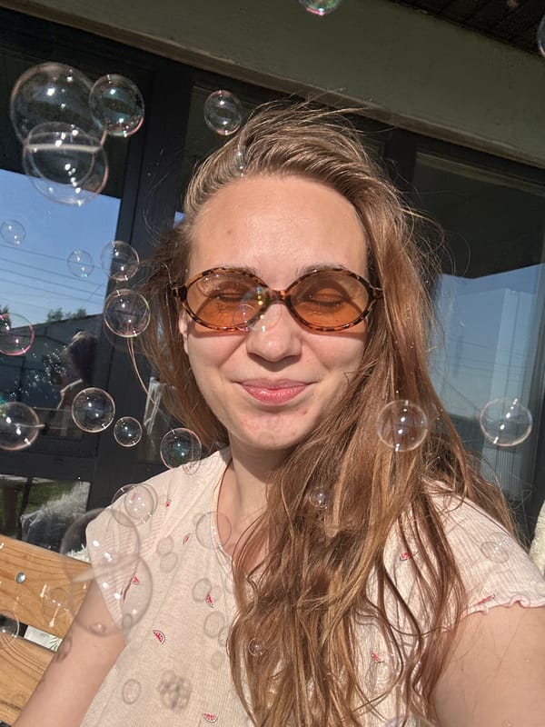 Woman and child enjoy bubble play on Russian deck