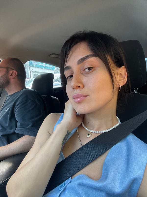 Car ride through midday Tbilisi traffic, selfies and street scenes