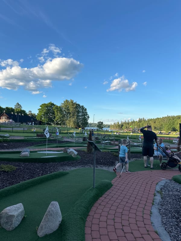 Afternoon at a recreational park: mini-golf, kites, and lake views